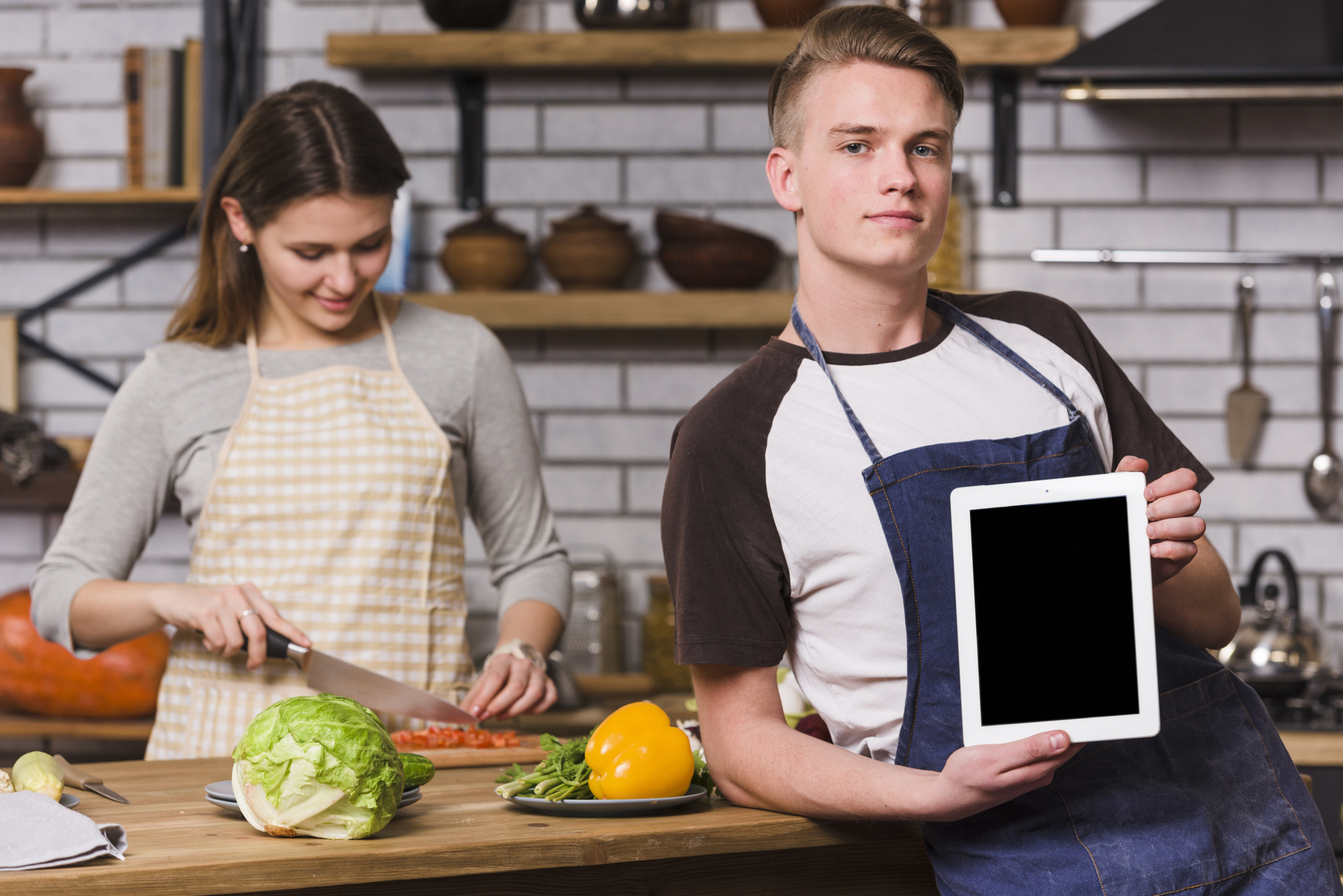 consultation with chef and tablet showing recipe
